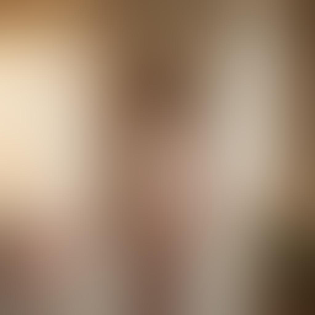 A confident plus-size woman in a beautiful, elegant lingerie set, radiating self-love and empowerment. She stands in a softly lit room filled with delicate flowers and soft fabrics, representing femininity and grace. Include warm colors that evoke comfort and positivity, with a focus on showcasing confidence. Artistic details like gentle sunlight filtering through sheer curtains. super-realistic. warm tones. soft background.